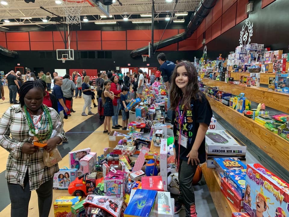 Joy of Giving Event Sends Families Home With New Cars, TVs and Hope!